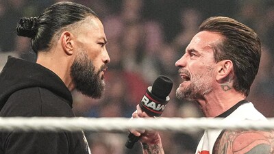 Roman Reigns (left) and CM Punk had a heated exchange (Picture Credit: WWE)