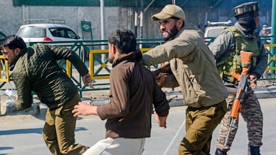 Police stop people during a protest against the alleged killing of Iran's Supreme Leader Ayatollah Ali Khamenei in a US-Israel strike in Kashmir. (PTI)