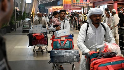 Indian passengers arrive at the airport of Ahmedabad on late March 3, 2026, after they were stranded in Jeddah (Saudi Arabia). (AFP photo)