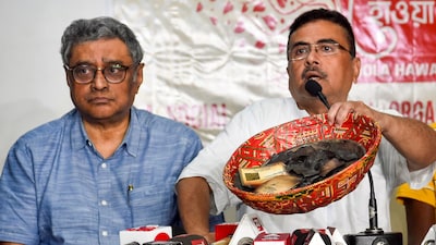 Swapan Dasgupta (left) will contest the upcoming Assembly election from the Rashbehari constituency on a BJP ticket. (Image: PTI)