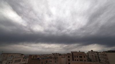 This photograph shows Tehran's skyline covered with clouds and smoke after overnight strike on the Tehran Oil Refinery on March 8. (AFP photo)