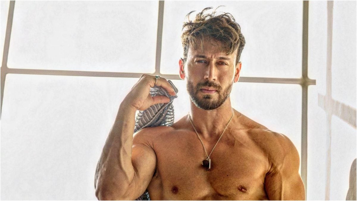 Tiger Shroff standing in front of his Pune flat