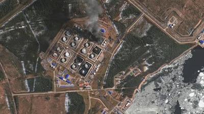 A satellite near-infrared image shows smoke rising from damaged oil storage tanks after a Ukrainian attack in Russia's Primorsk on March 29, 2026. (Image: Reuters)