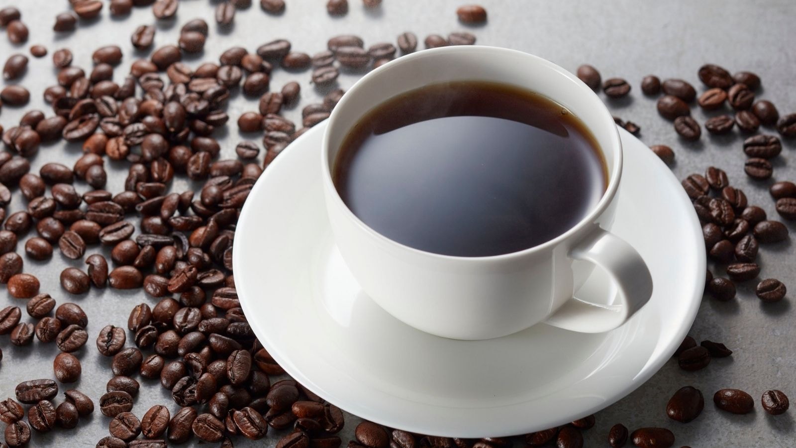 Metabolism and Digestion: Caffeine helps break down natural fats. Since black coffee contains more caffeine than green tea, it may boost metabolism more quickly and help burn calories even at rest. Metabolism and Digestion: Caffeine helps break down natural fats. Since black coffee contains more caffeine than green tea, it may boost metabolism more quickly and help burn calories even at rest.