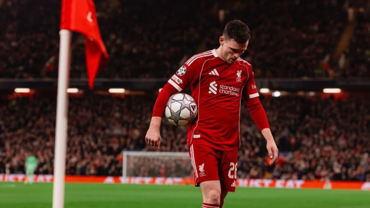 Andy Robertson in a Liverpool kit smiling at Anfield