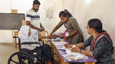 An elderly woman casts her vote during the first phase of Kerala local body elections, in Thiruvananthapuram, Kerala. (IMAGE: PTI)