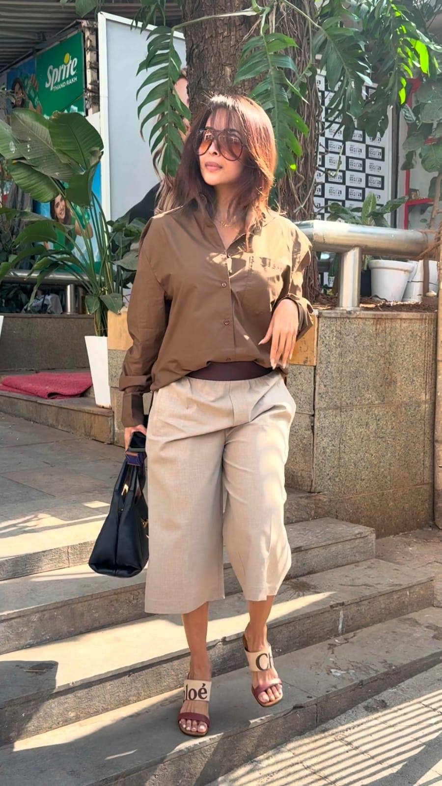 The actress wore a button-down shirt paired with breezy culotte pants, striking the perfect balance between comfort and chic. (Image: Viral Bhayani)