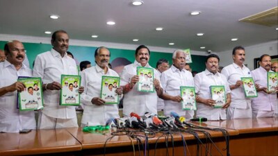 AIADMK chief Edappadi K Palaniswami (centre) with others releases the party's manifesto ahead of the state Assembly elections (Photo: PTI)