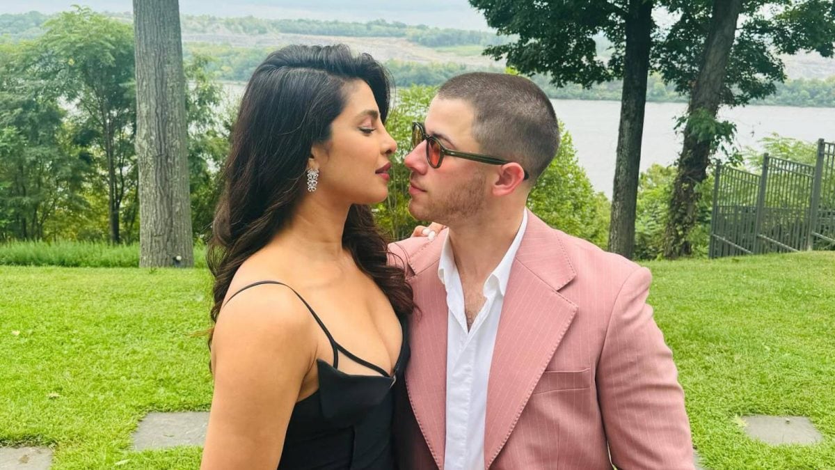 Nick Jonas smiling during a cultural event