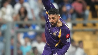 Kolkata Knight Riders' Varun Chakravarthy bowls a delivery during the Indian Premier League cricket match between Mumbai Indians and Kolkata Knight Riders in Mumbai, India, Sunday, March 29, 2026. (AP Photo/Rafiq Maqbool)