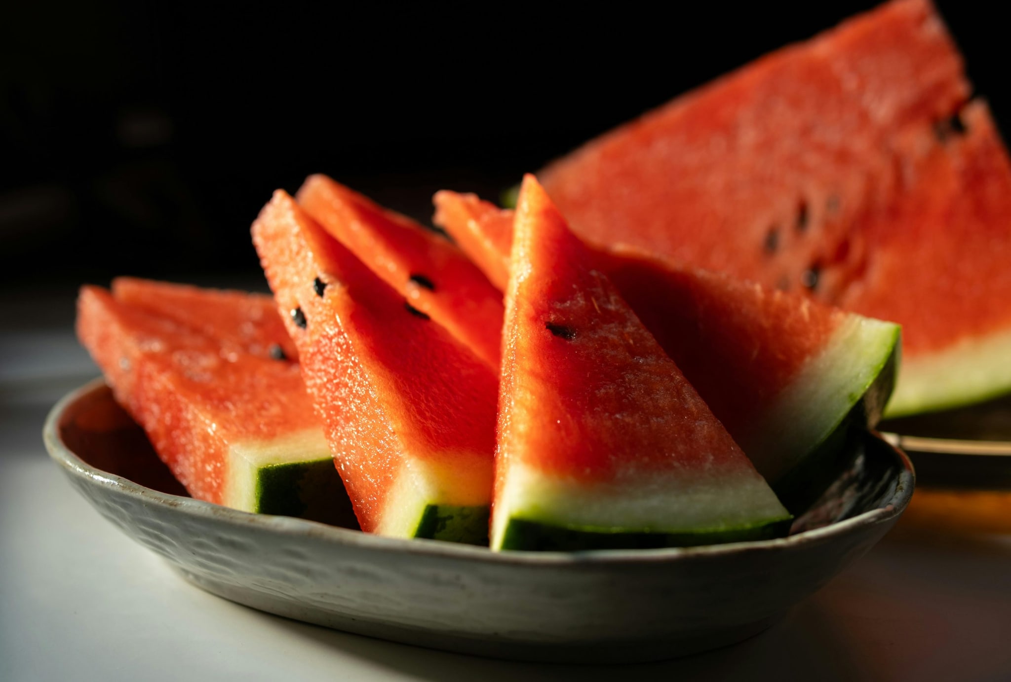 Chop the watermelon into cubes. Place them in a line on a baking sheet and freeze for 3 hours until solid. (Image: Pexels)