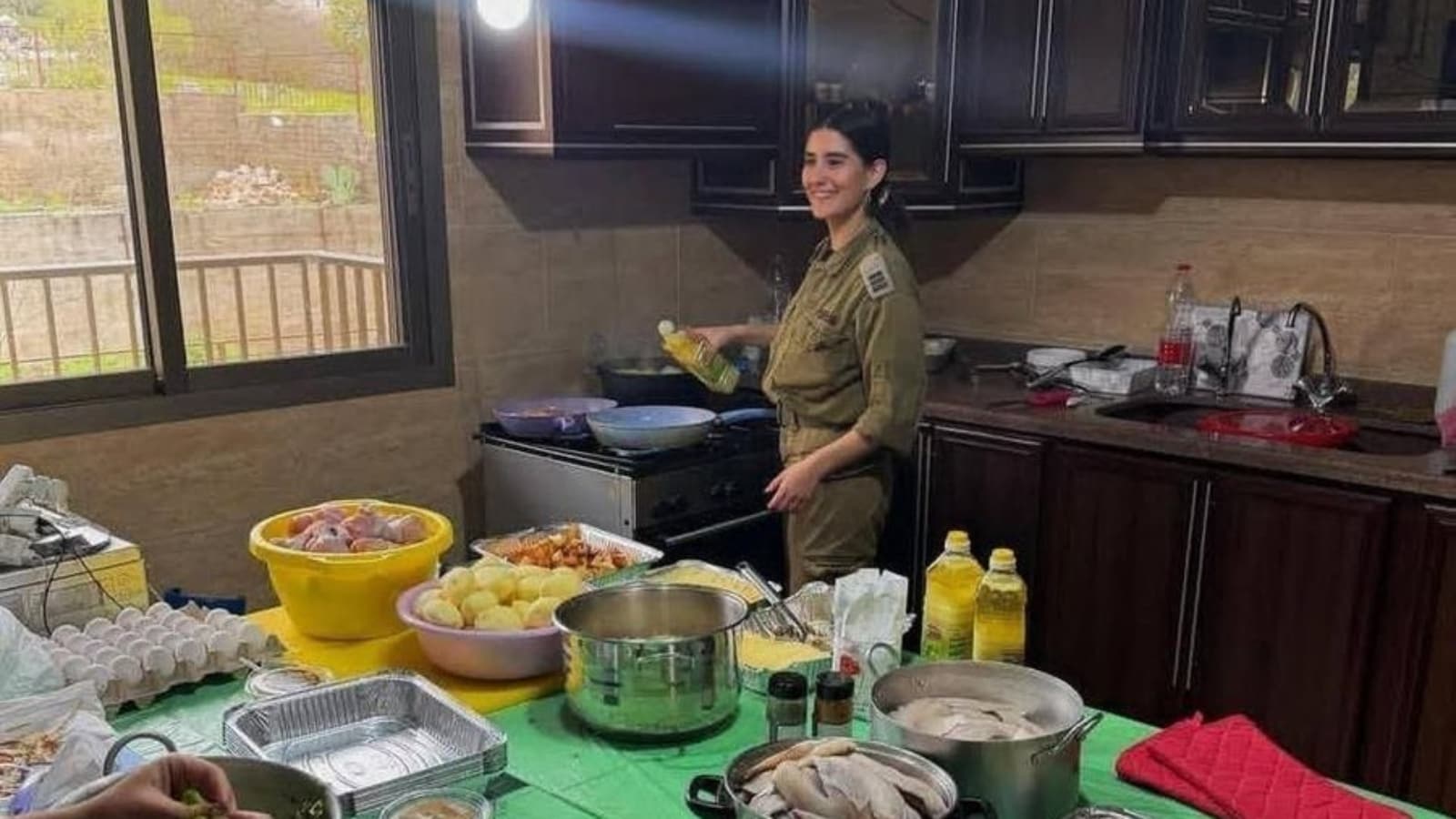 Viral Image Shows IDF Soldier Smiling While Cooking In Occupied Lebanese Home, Sparks Backlash