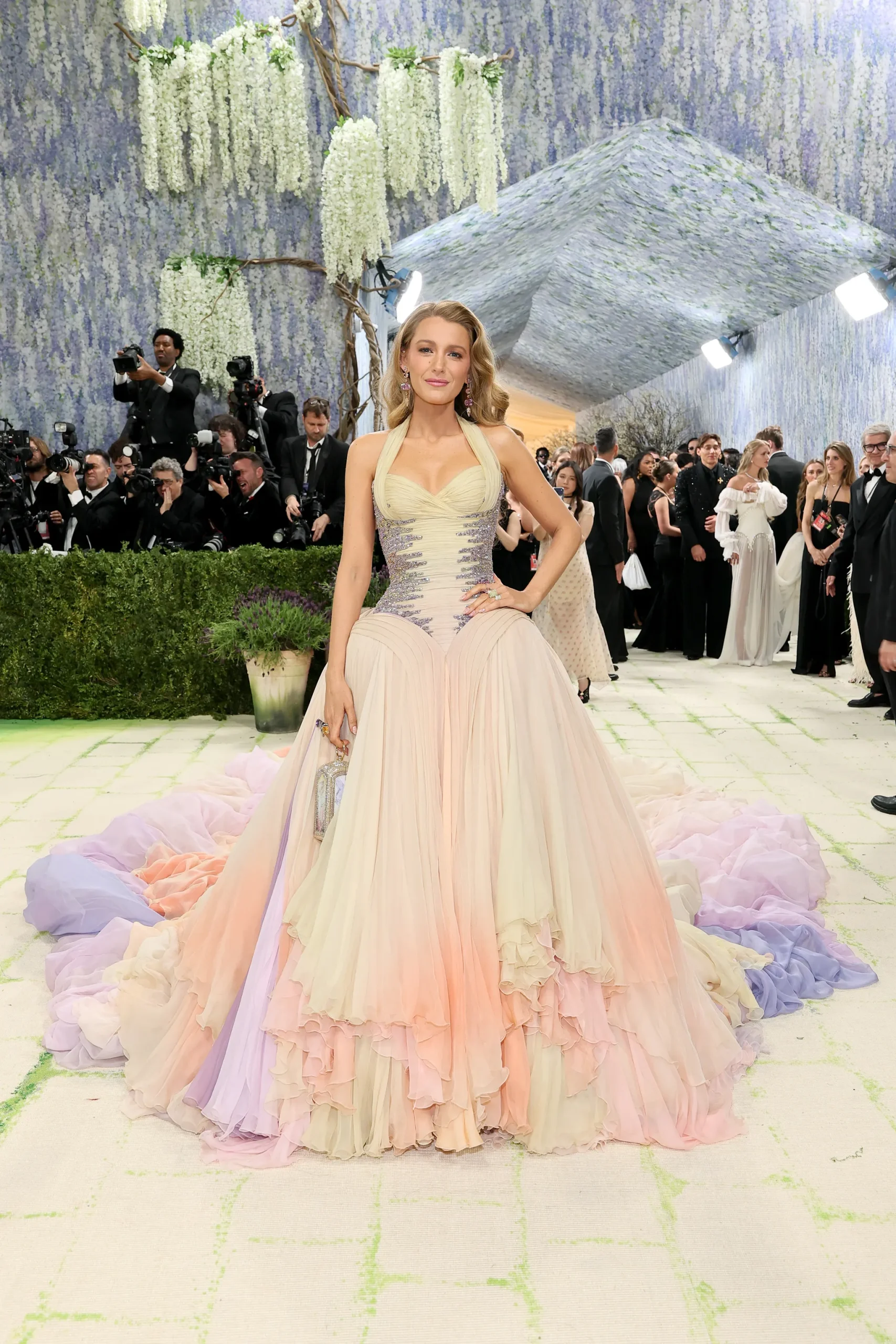 Blake Lively returned to the Met Gala red carpet in a pastel-hued archival Versace ball gown. 