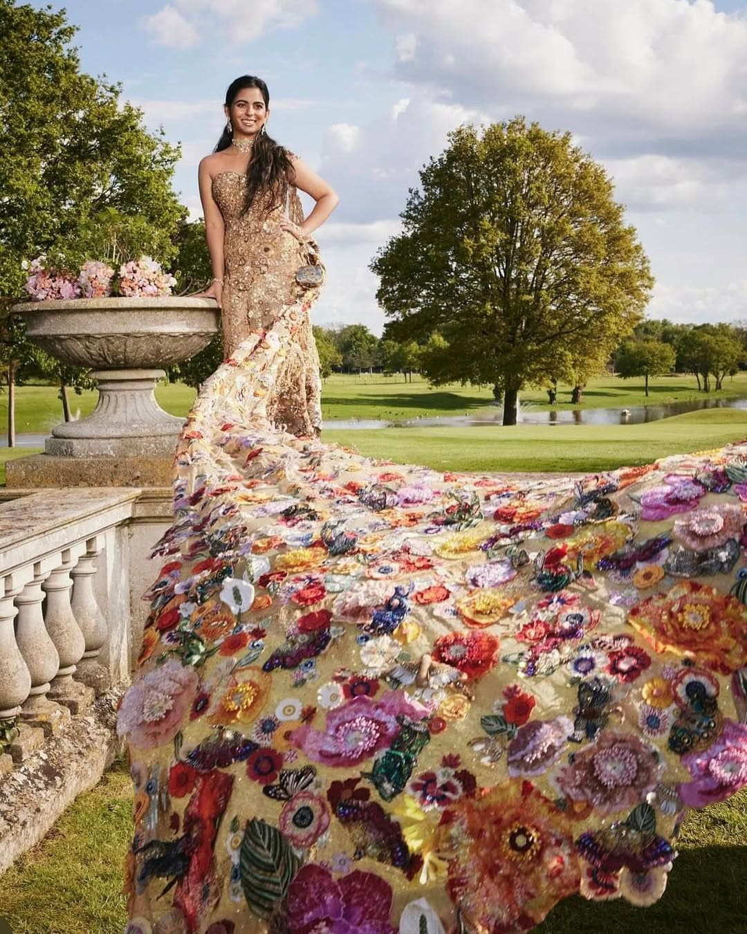 Isha Ambani: At the Met Gala 2024, Isha Ambani made a striking appearance in a hand-embroidered couture sari gown by Rahul Mishra. The ensemble was intricately adorned with motifs of flowers, butterflies, and dragonflies, brought to life through traditional techniques like zardozi, nakshi, and dabka. She completed the look with a statement choker, earrings by Viren Bhagat, and a bag from Swadesh and Jade by Monica and Karishma, adding a refined finishing touch. (Image: Instagram)