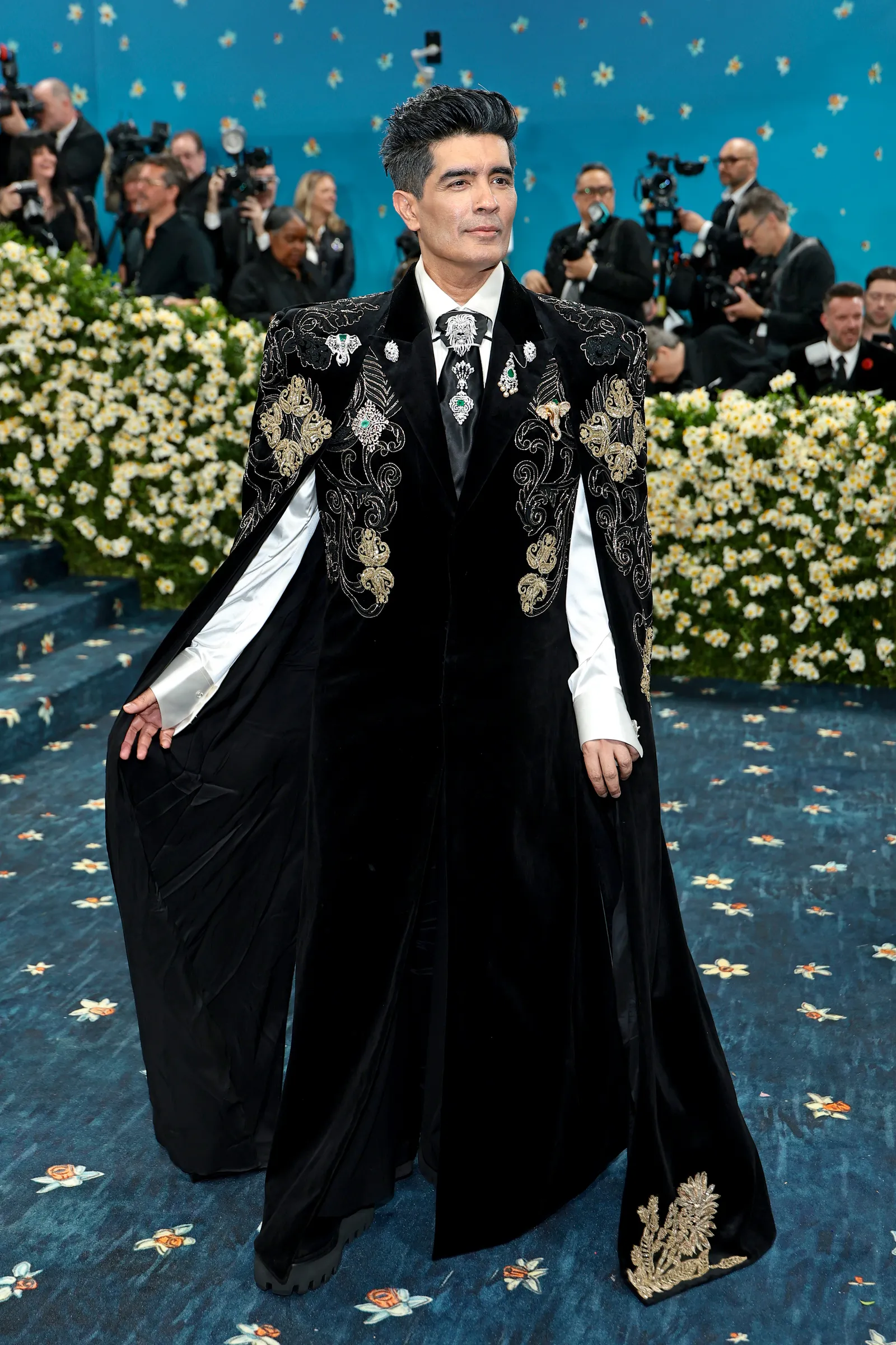 Manish Malhotra: Making his Met Gala debut, Manish Malhotra stepped out in a sculptural black sherwani cape that fused Indian couture with refined dandy-inspired elegance for the “Tailored for You” dress code. Accented with intricate embroidery, glass bead detailing, and brooches from his own High Jewellery line, the ensemble highlighted rich, layered craftsmanship and a strong design sensibility. (File Photo)