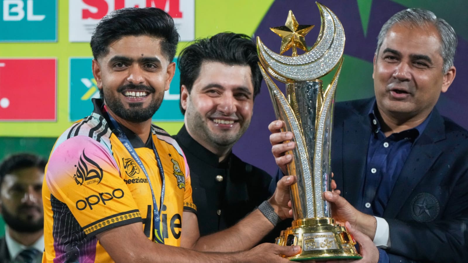 Babar Azam gets the PSL trophy from Mohsin Naqvi Babar Azam gets the PSL trophy from Mohsin Naqvi