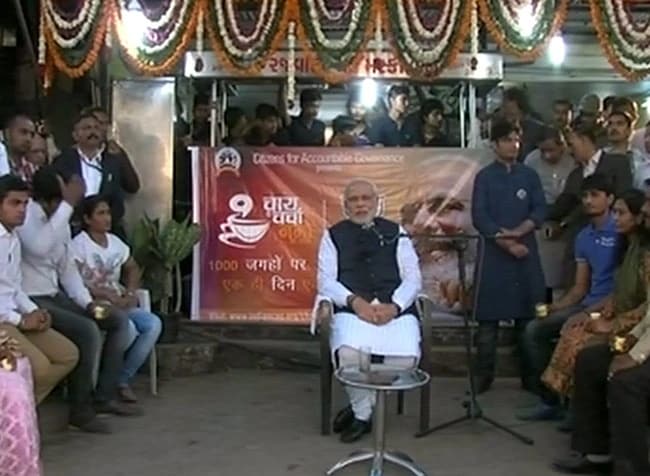  PM Narendra Modi engages citizens at tea stalls across India, calling them a ‘footpath parliament’ during his iconic 2014 campaign.