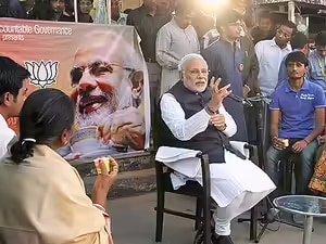 Narendra Modi held live conversations at tea stalls across India during the 2014 election campaign. He described tea stalls as a kind of “footpath parliament” where ordinary Indians discuss politics and life. The campaign was also linked to his background story of helping sell tea as a child.
