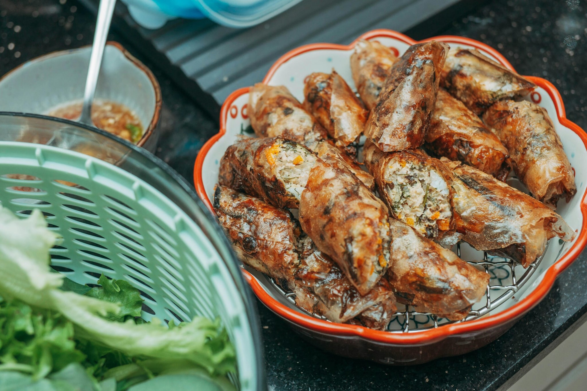  Remove the rolls from the oil, drain them in paper towels to remove excess grease, and serve hot. 