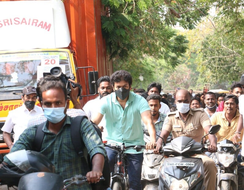 In 2021, a simple image turned into political symbolism overnight: Vijay cycling to a polling booth in Chennai. Though his team denied any protest angle, many interpreted it as a statement against rising fuel prices, and as the clearest sign yet that the actor was preparing for public life. (News18 Kannada)