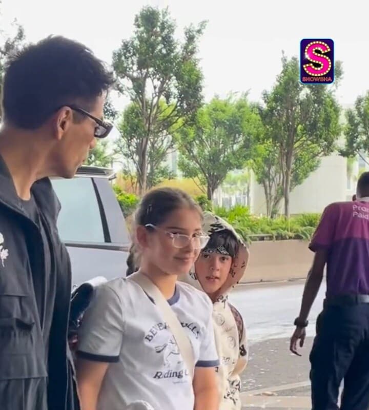 Karan Johar arrives at the airport with twins Yash and Roohi, all set for their next adventure.