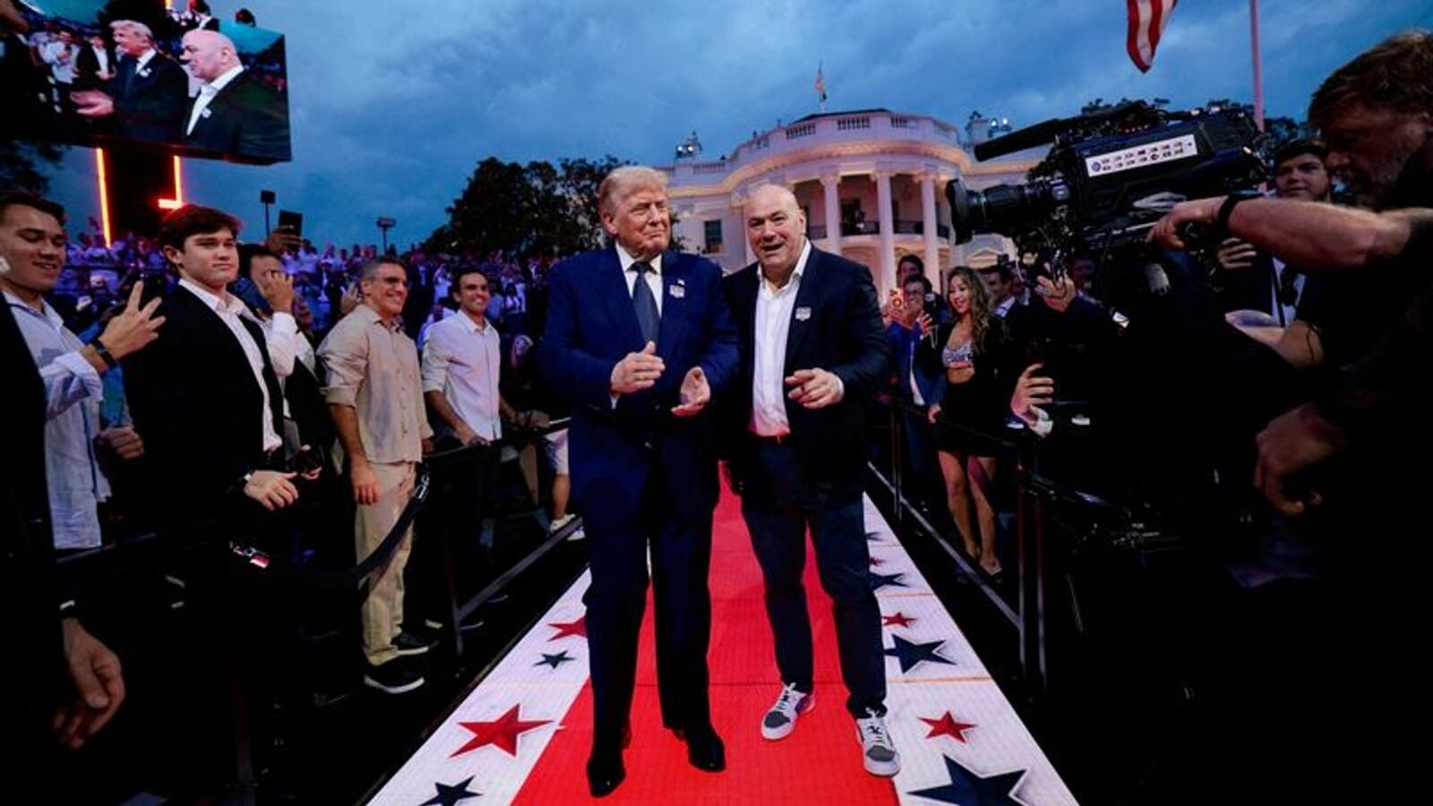 U.S. President Donald Trump arrives with UFC CEO Dana White for UFC Freedom 250 on the South Lawn of the White House in Washington, D.C., U.S., June 14, 2026. REUTERS/ Evan Vucci