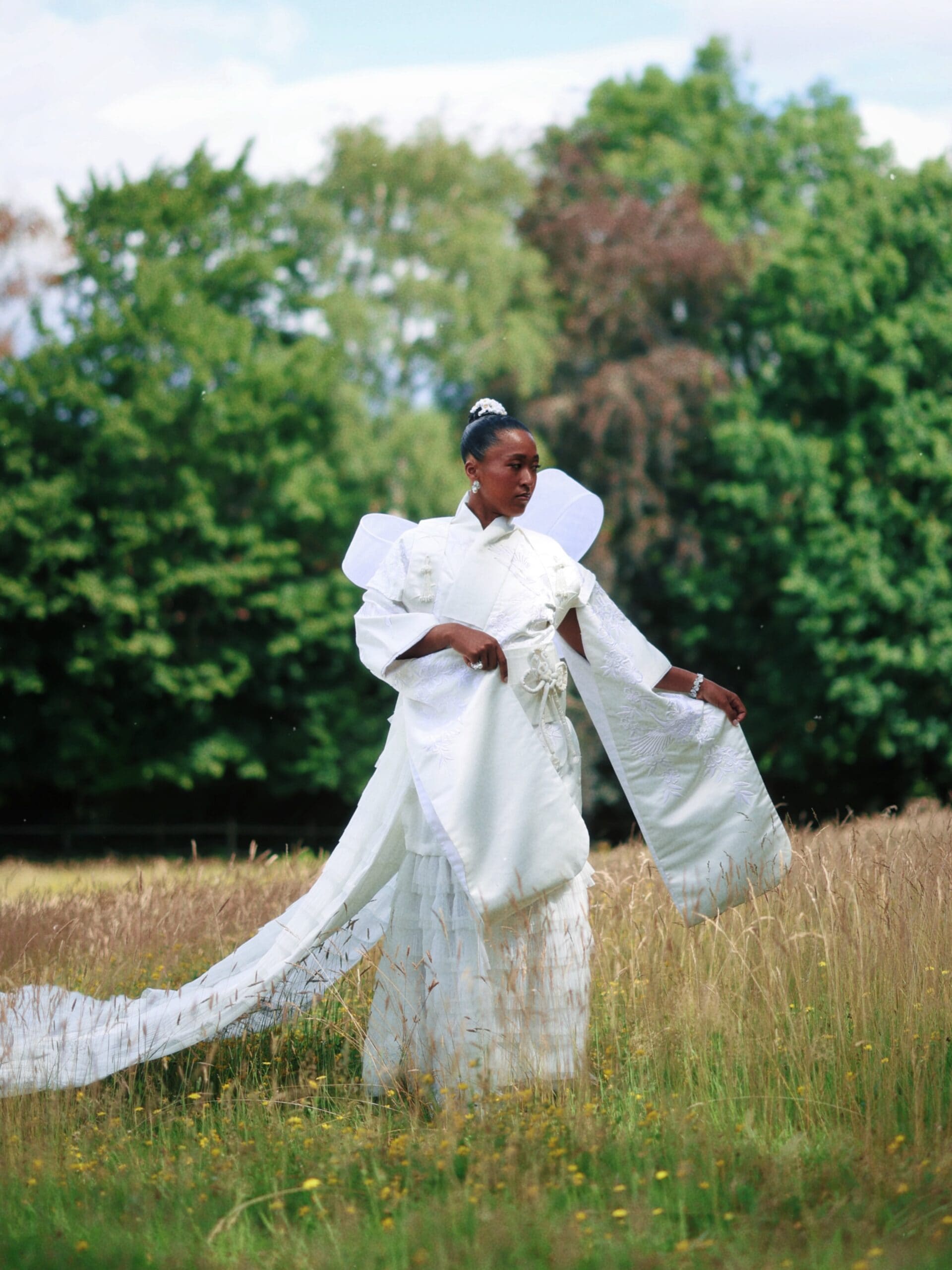 She explained that Wimbledon's emphasis on wearing white immediately reminded her of the striking white kimono worn by Liu in the film. Combined with her desire to celebrate her Japanese roots, the movie became an unexpected yet fitting reference for the look. She explained that Wimbledon's emphasis on wearing white immediately reminded her of the striking white kimono worn by Liu in the film. Combined with her desire to celebrate her Japanese roots, the movie became an unexpected yet fitting reference for the look.