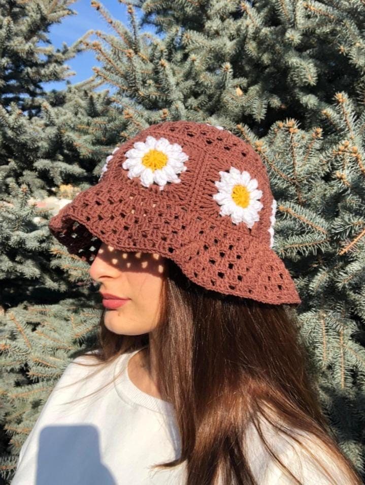 Crochet Bucket Hats: When your hair completely refuses to cooperate, simply tuck it away. A trendy, breathable crochet bucket hat offers an effortless boho-chic vibe, completely hiding flat roots and unruly texture while keeping you cool and beautifully shaded from intense afternoon sunshine. (Image: Pinterest)