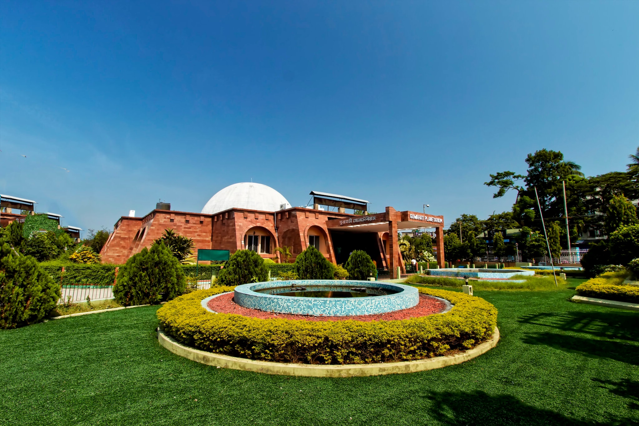 Guwahati Planetarium: Inaugurated in 1994, Guwahati Planetarium is one of India’s oldest and a top attraction in the city. Situated on MG Road, it offers an immersive experience in astronomy with state-of-the-art projection systems and dome theatres showcasing celestial shows and space exploration.