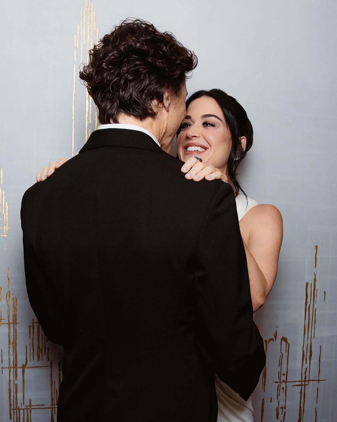 The pair have been linked since the summer of 2025, following Perry's split from actor Orlando Bloom. Perry first made their relationship Instagram official in December 2025 with photos from a trip to Japan. Since then, they have been spotted together at several events, including Coachella and the World Economic Forum in Davos.