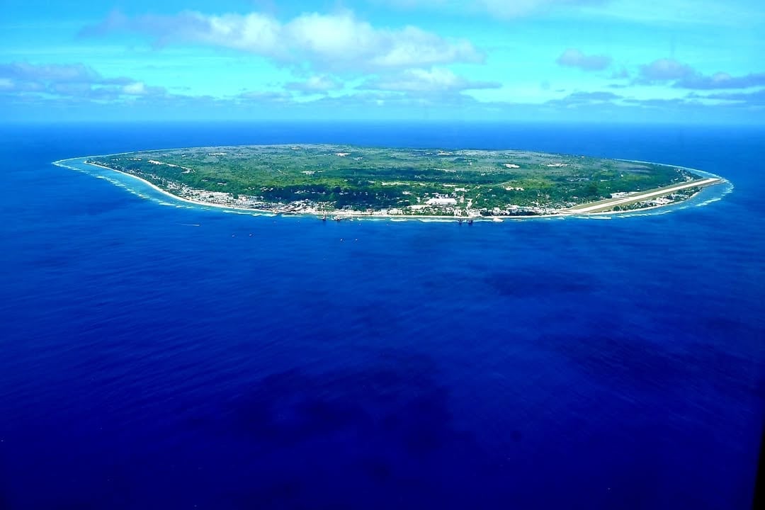 Reportedly, Nauru’s population is estimated to be around 12,500 as of 2026. There is no official capital, but the government offices are located in Yaren district. Nearly two-third of the population are indigenous Nauruans. The official languages are Nauruans and English. (Representative Image: Pexels)