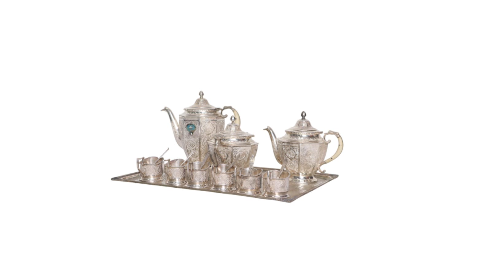 Up for grabs is this Indo Persian style tea set, featuring an intricate design, comes with a stately teapot, a matching lidded sugar bowl, a creamer, and a large ceremonial serving tray, accompanied by six delicate tea cups. Its highest quoted price is Rs  7,60,080  