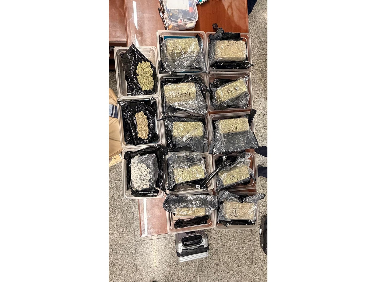 Representative image: customs officials with seized vacuum-sealed packets of hydroponic weed at an Indian airport Representative image: customs officials with seized vacuum-sealed packets of hydroponic weed at an Indian airport