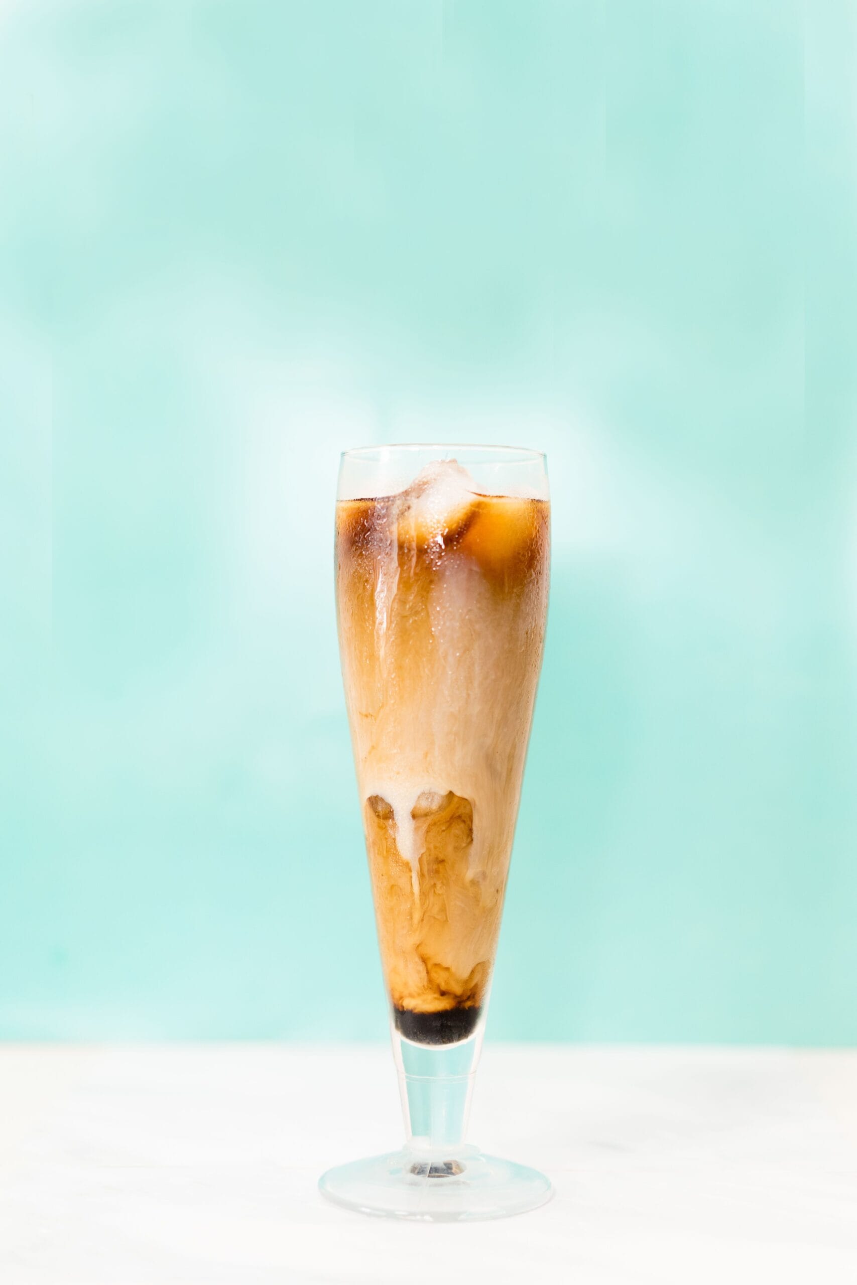 Ingredients: 1 cup chilled coconut water, 1/2 cup cold brewed coffee (or strong instant coffee, cooled), ice cubes, 1-2 teaspoons sugar or honey (optional, adjust to taste).