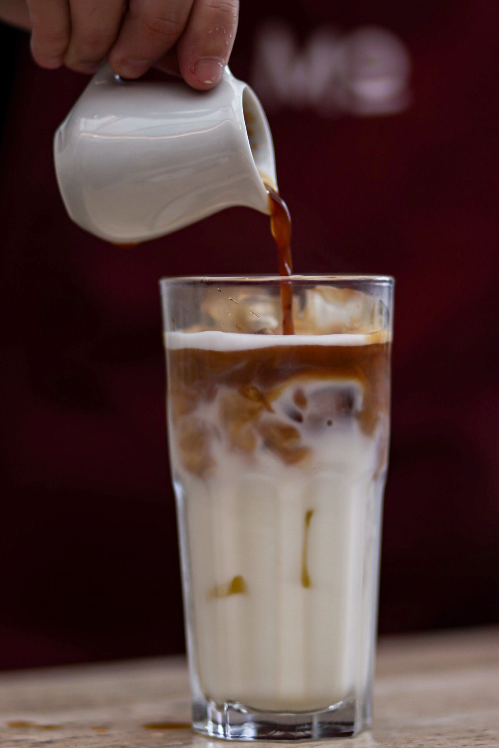Add the coffee: Slowly pour in the cooled coffee. You can mix it fully for a blended taste or let it layer for a visually appealing look.