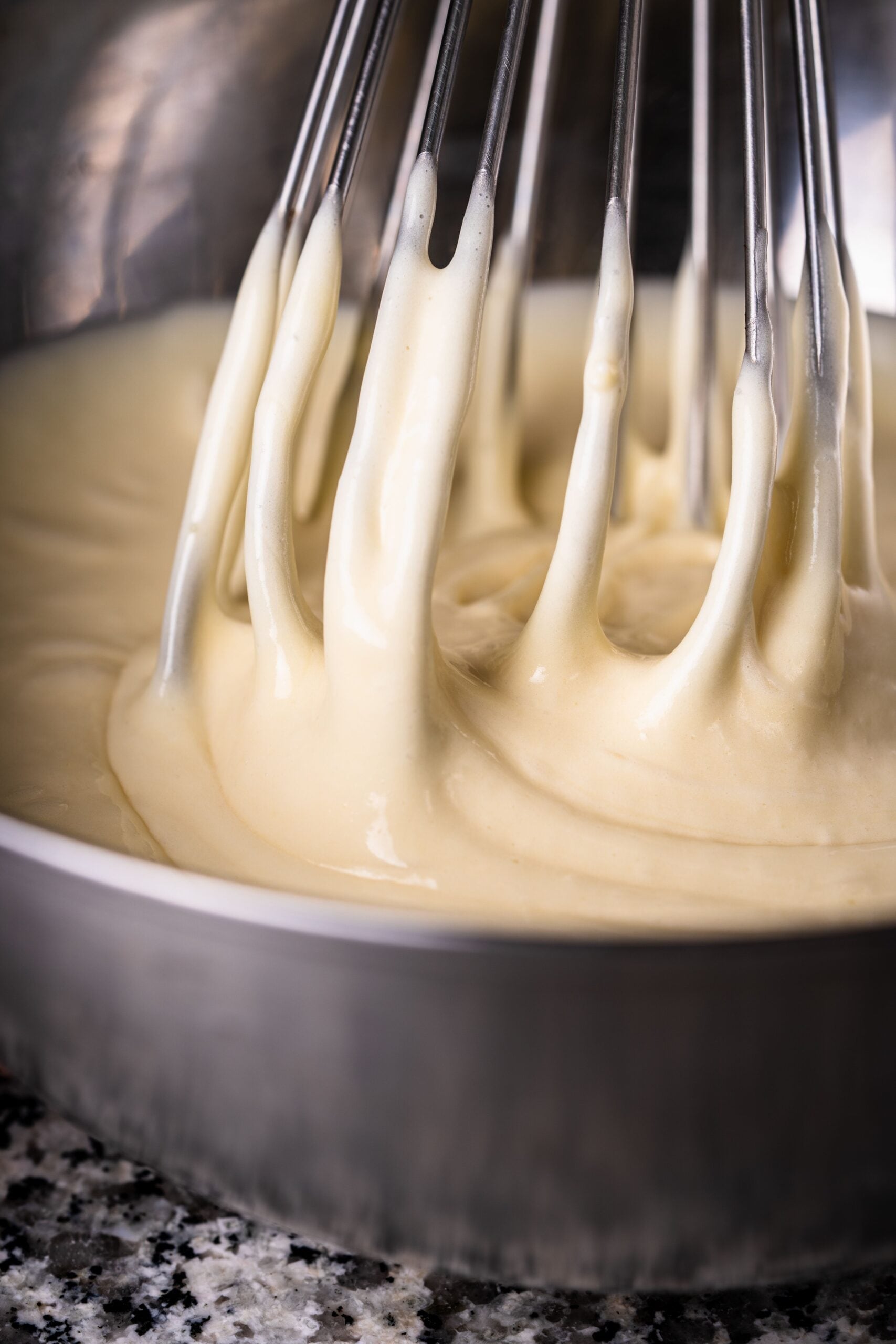  Keep stirring until all the flour has been incorporated. Beat vigorously and continue adding the remaining milk. 