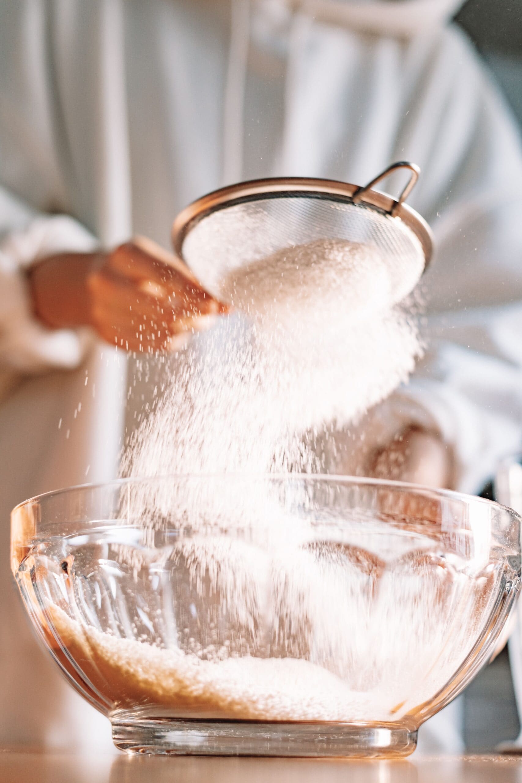  Firstly, preheat the oven to 240 degree Celsius. Sift the flour and salt into a bowl. Make a well in the centre. 