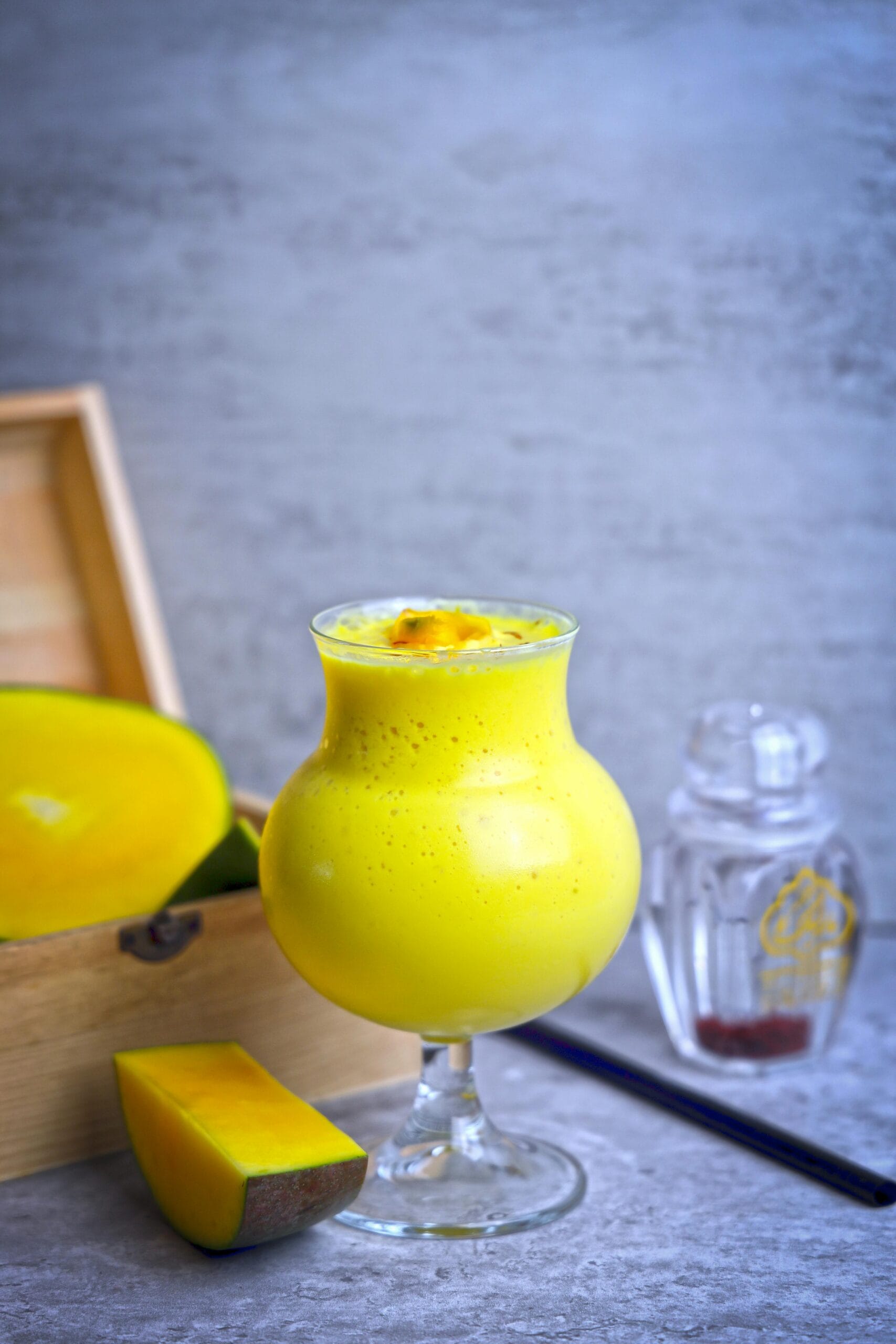 Take a blender and add chopped mango, soaked almonds, cold milk, cardamom powder and blend to get a smooth and creamy consistency. 