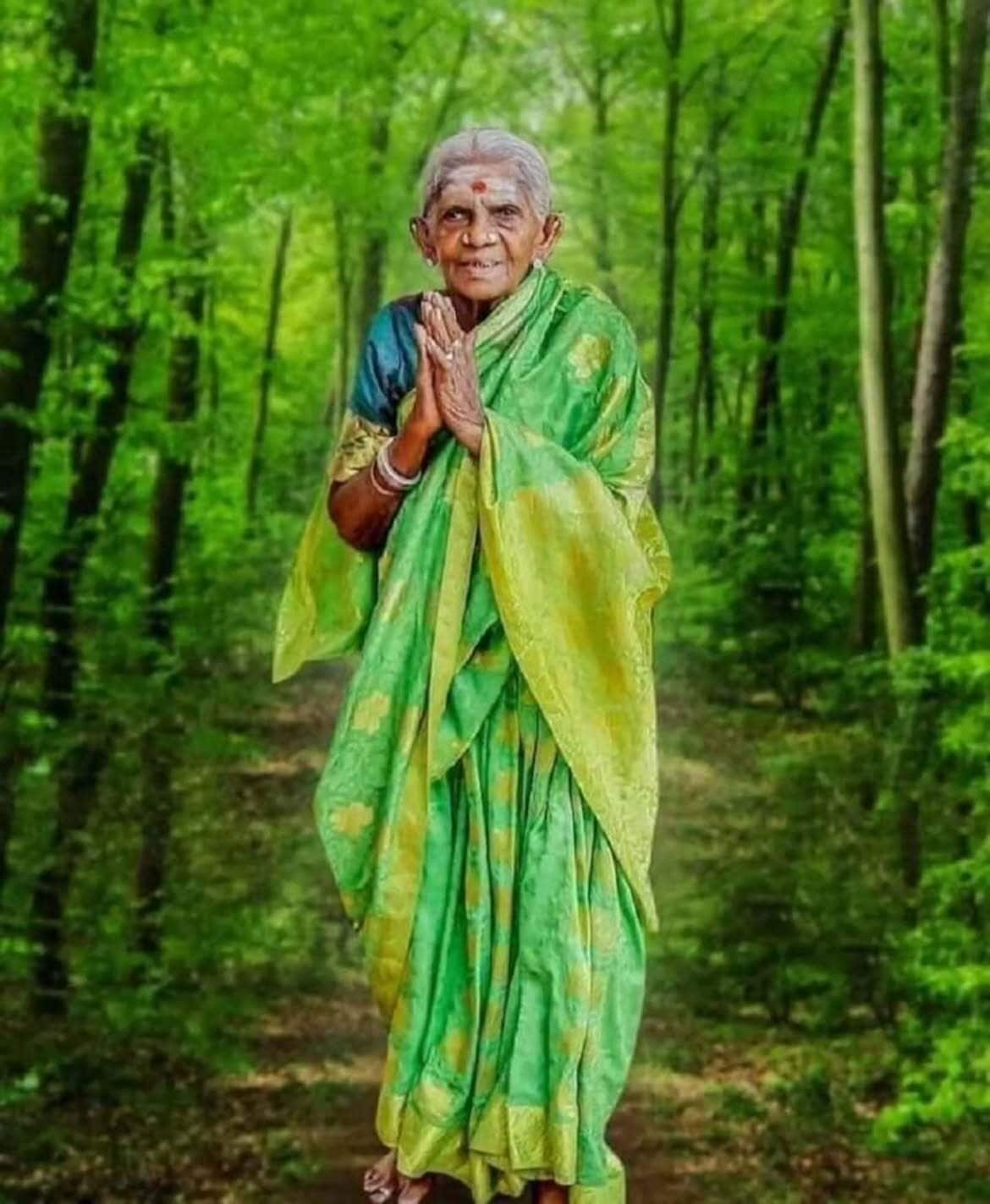 Years of their care have transformed a barren 4.5-kilometre stretch between Holikal and Cuddur into an boulevard of 385 banyan trees, bringing shade and life to the road. Over the decades, Thimmakka has nurtured more than 8,000 trees across Karnataka. They cooled the land, sheltered birds and wildlife, supported biodiversity, and inspired local communities to plant their own trees. Years of their care have transformed a barren 4.5-kilometre stretch between Holikal and Cuddur into an boulevard of 385 banyan trees, bringing shade and life to the road. Over the decades, Thimmakka has nurtured more than 8,000 trees across Karnataka. They cooled the land, sheltered birds and wildlife, supported biodiversity, and inspired local communities to plant their own trees.