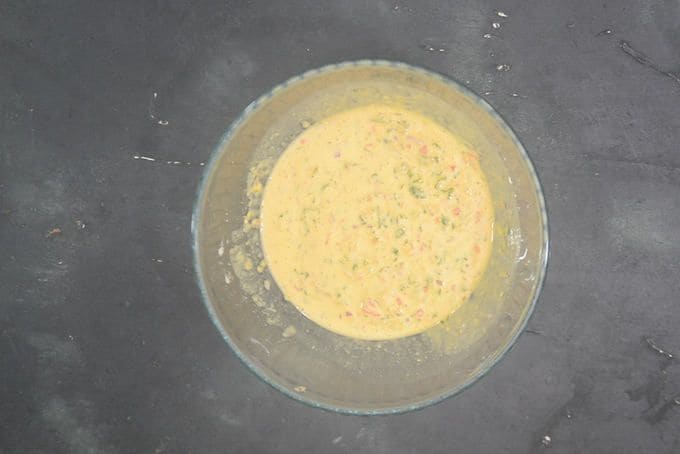 Step 1: In a mixing bowl, combine the besan, turmeric, Kashmiri red chilli powder, cumin powder, ajwain, crushed kasuri methi, salt, curd and lemon juice. Add water gradually to make a smooth, pourable batter. Let it rest for about 10 minutes.