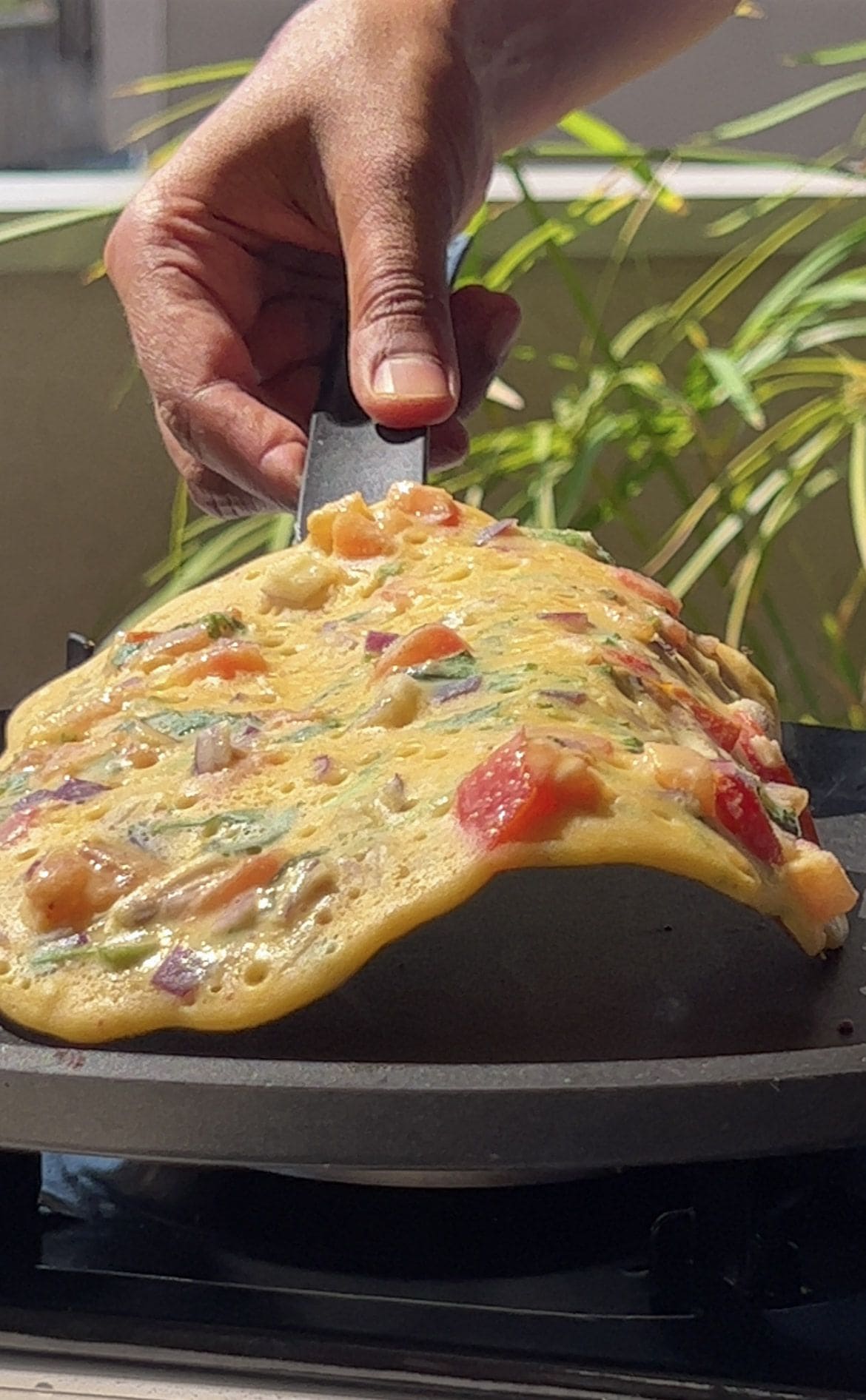 Step 5: Carefully flip the chilla and cook the other side until fully cooked and lightly crisp.