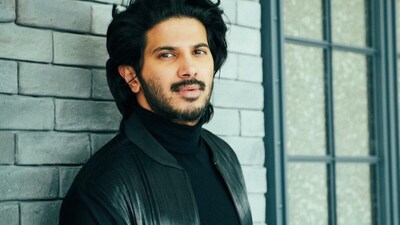 Dulquer Salmaan fan breaks past security while asking the actor for a photo.