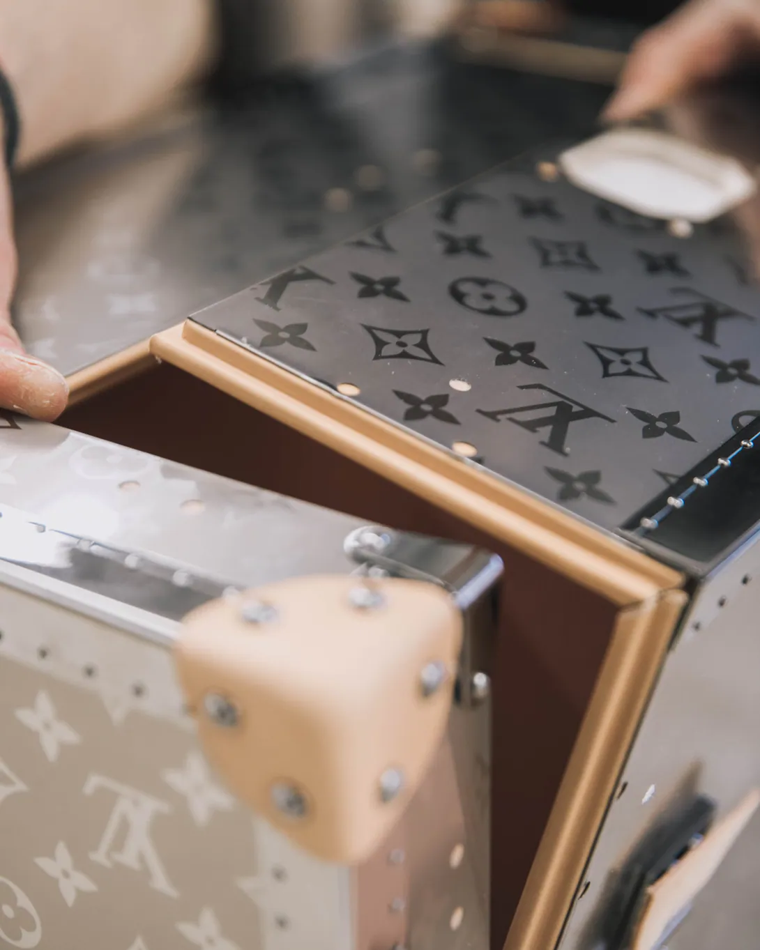 Inside, the trunk is lined with light beige leather, with a partnership logo shared between Louis Vuitton and FIFA built into the lid — a detail most fans will never see up close, but one that speaks to the level of craftsmanship going into a piece built to hold football's biggest prize. (Credit: Louis Vuitton)