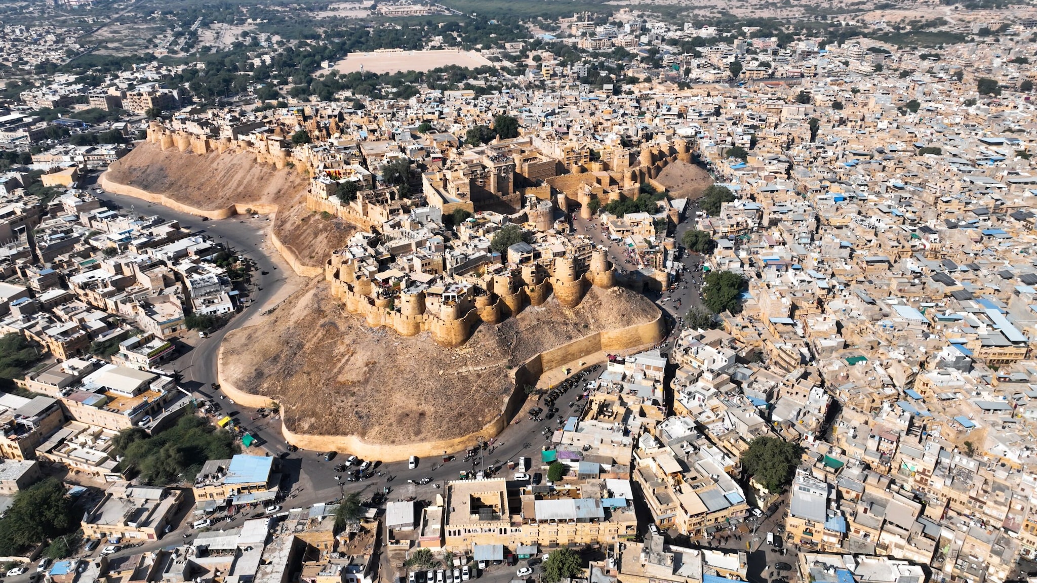 Jaisalmer, RajasthanKnown as the Golden City, Jaisalmer lies deep within the Thar Desert and receives only about 150-170 mm of rainfall each year. Its golden sandstone fort, sand dunes, and desert safaris make it one of Rajasthan's most popular tourist destinations.