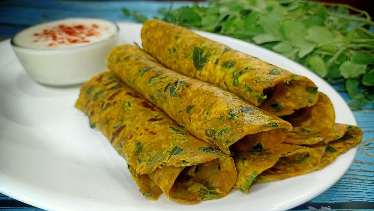 Moringa Leaf Paratha: Knead finely chopped drumstick leaves directly into whole wheat dough alongside carom seeds, ginger, and green chilies. Pan-fry with minimal oil to create a warm, gut-friendly breakfast that keeps you energized through overcast, dreary weather. Moringa Leaf Paratha: Knead finely chopped drumstick leaves directly into whole wheat dough alongside carom seeds, ginger, and green chilies. Pan-fry with minimal oil to create a warm, gut-friendly breakfast that keeps you energized through overcast, dreary weather.