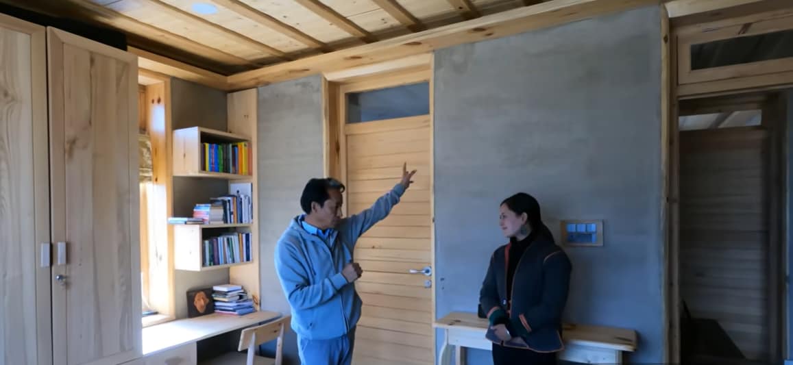 What really sets the house apart is the way it captures and stores solar energy. Instead of relying on traditional wood-burning bukharis or electric heaters, the house uses passive solar heating. Large south-facing windows invite sunlight into the living spaces all day long, while specially designed thermal walls absorb and slowly release heat after sunset. According to Wangchuk, the system helps maintain comfortable indoor temperatures of 18 to 20 degrees Celsius even during the frigid Ladakhi nights. (Credit: Youtube/Tribal Girl) What really sets the house apart is the way it captures and stores solar energy. Instead of relying on traditional wood-burning bukharis or electric heaters, the house uses passive solar heating. Large south-facing windows invite sunlight into the living spaces all day long, while specially designed thermal walls absorb and slowly release heat after sunset. According to Wangchuk, the system helps maintain comfortable indoor temperatures of 18 to 20 degrees Celsius even during the frigid Ladakhi nights. (Credit: Youtube/Tribal Girl)