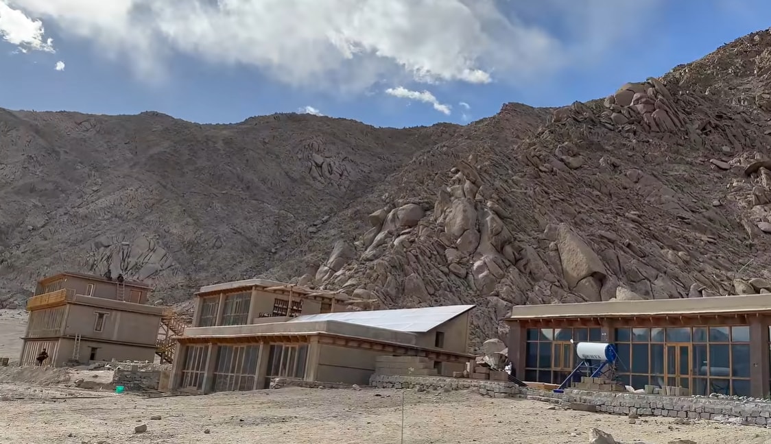 Despite its traditional structure, the interiors are completely modern. Comfortable sofas sit alongside antique wooden furniture, while a modular kitchen blends seamlessly into a communal dining area inspired by traditional Ladakhi homes, where families cook, eat and spend time together in a shared space. The rooms have attached bathrooms, proving that sustainability does not mean sacrificing comfort. (Credit: Youtube/Tribal Girl) Despite its traditional structure, the interiors are completely modern. Comfortable sofas sit alongside antique wooden furniture, while a modular kitchen blends seamlessly into a communal dining area inspired by traditional Ladakhi homes, where families cook, eat and spend time together in a shared space. The rooms have attached bathrooms, proving that sustainability does not mean sacrificing comfort. (Credit: Youtube/Tribal Girl)