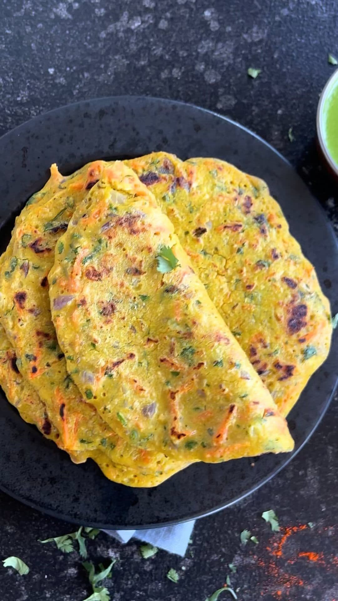Step 4: Pour the prepared batter over the vegetables, spreading it gently to form a thick chilla. Cover with a lid and cook on medium heat until the base is golden and the top begins to set.