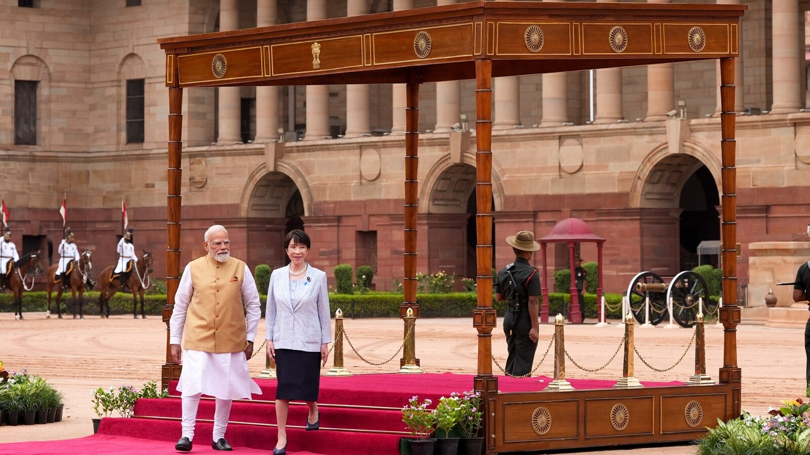 At the forecourt of the sprawling presidential complex, the Japanese Prime Minister stood on a ceremonial platform, with Prime Minister Narendra Modi standing next to her during the ceremony. (PTI Photo/Ravi Choudhary)