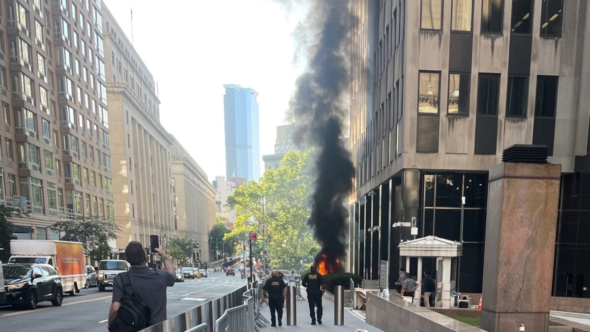 Man arrested after fire set outside New York immigration building